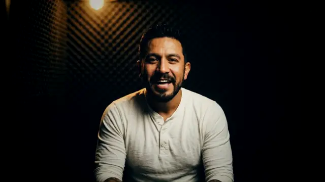 Ruben laughing in the booth
